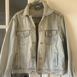 Adika, light blue denim jean jacket with lightning design on back good condition